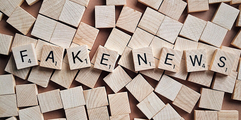 "fake news" spelled out in scrabble letters