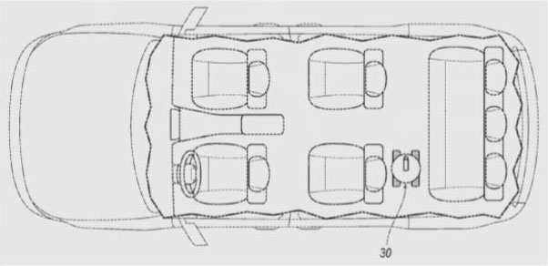 Fig. 2. An example vehicle with the passenger cabin exposed. The robot [30] can be positioned so that it is out of the way of the occupants unless needed.