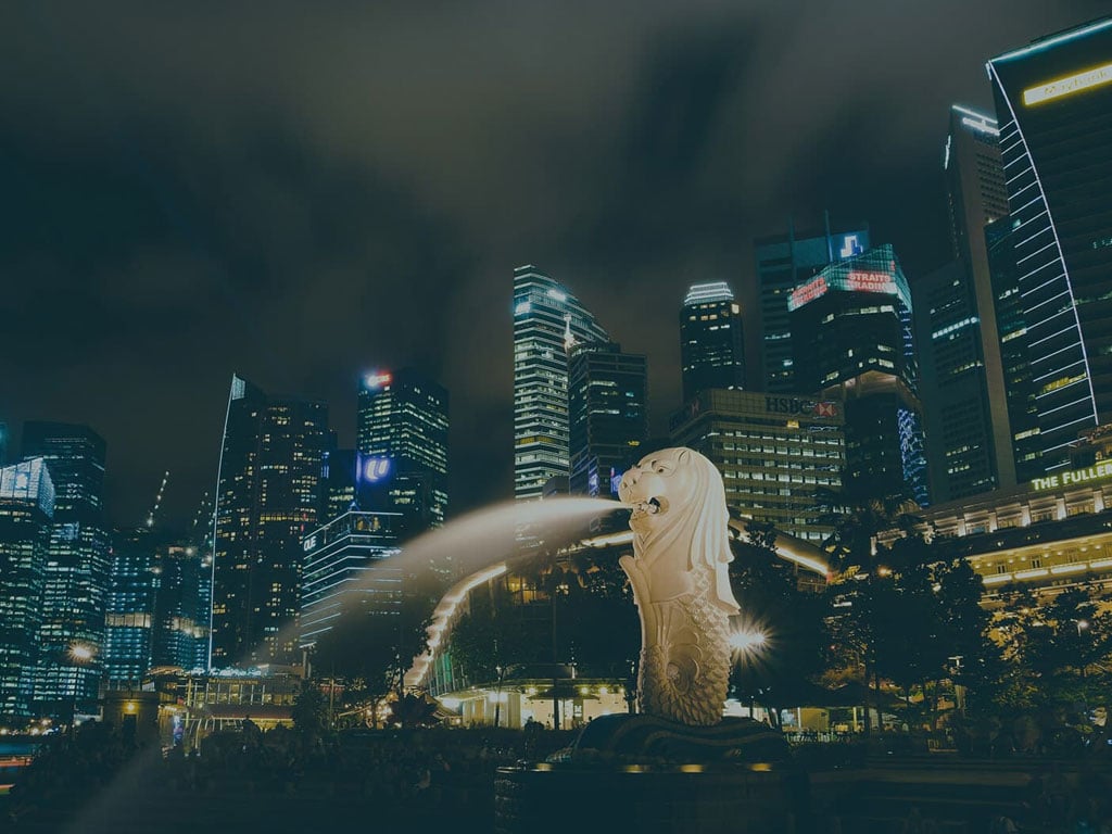 evening cityscape of Singapore with Merlion in the center
