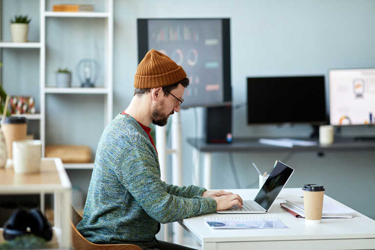 young-male-employee-or-designer-sitting